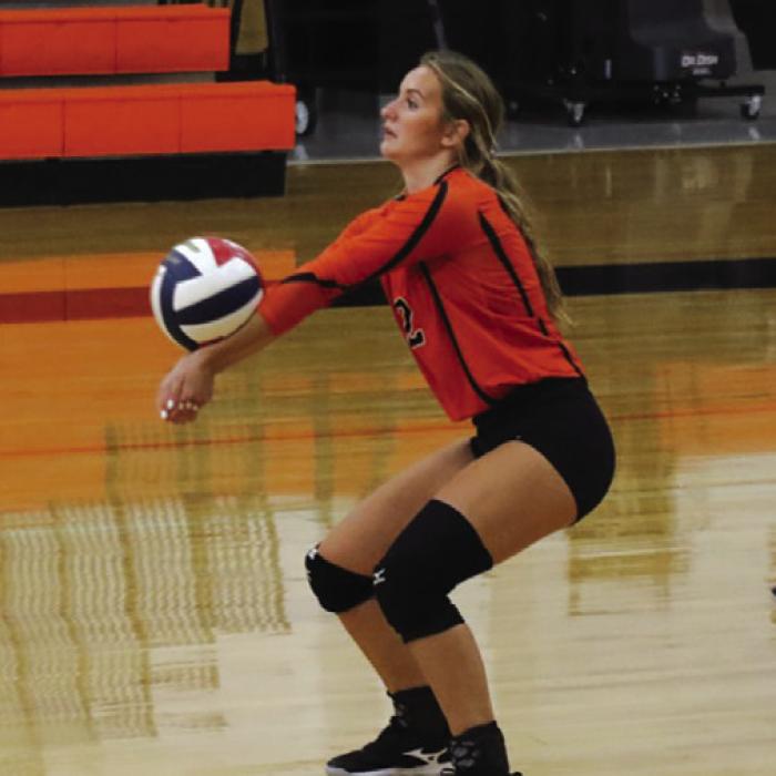 Schulenburg’s Miranda Bonner digs a ball in Thursday’s match against Rice. Photo by Audrey Kristynik