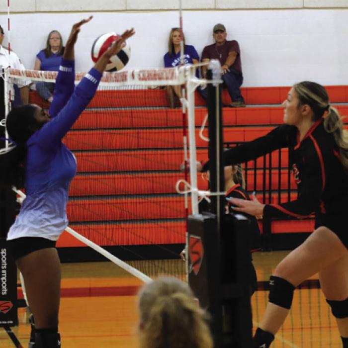 Schulenburg’s Greenli Van Zandt spikes a ball past a Rice blocker in Thursday’s match. Photo by Audrey Kristynik