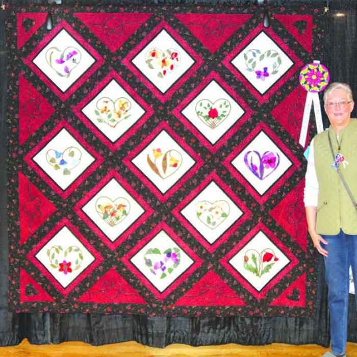 Best of Show - “Hearts and Flowers” by Brenda Perry, San Antonio.