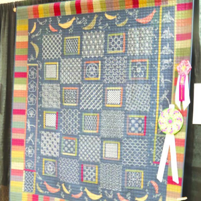 Judge’s Award (Jackie Hillman) and People’s Choice Award “Sashiko Sampler” by Kathi Babcock, La Grange.