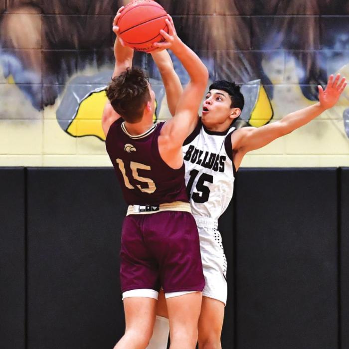 Senior Angel Netro blocks a Milano shot in the first half of Tuesday night’s game. Photo by Stephanie Steinhauser