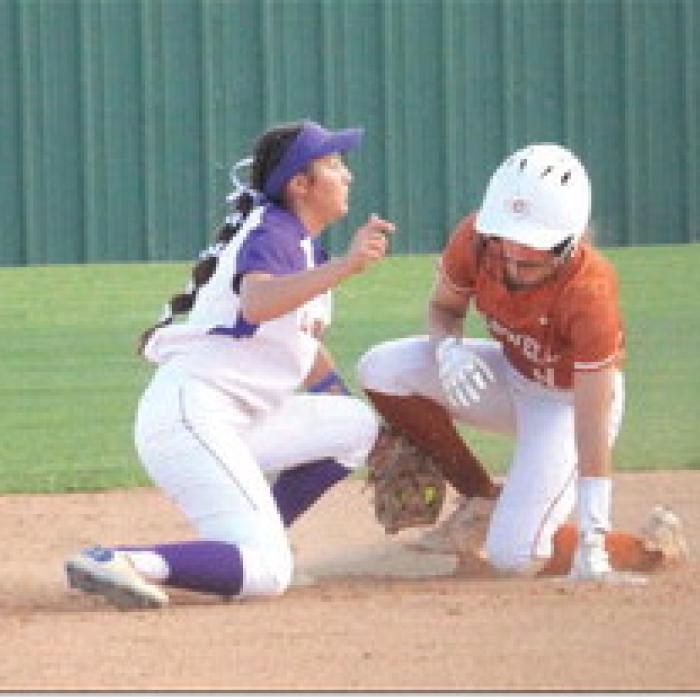 La Grange shortstop Anabella Dela Rosa tries to tag out a Caldwell runner at second. Photos by Jeff Wick