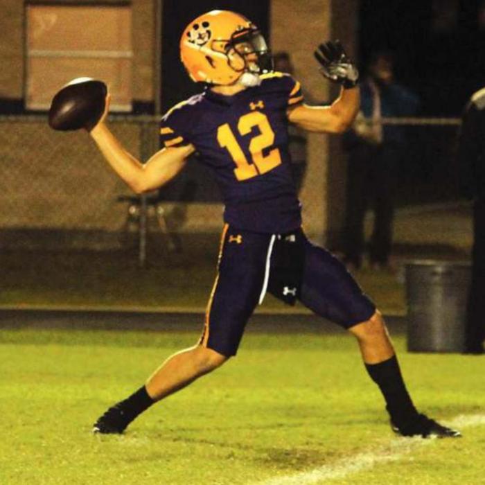 La Grange’s Clay Wolff reaches back and prepares to throw one of his three second quarter touchdowns. Photo by Jeff Wick