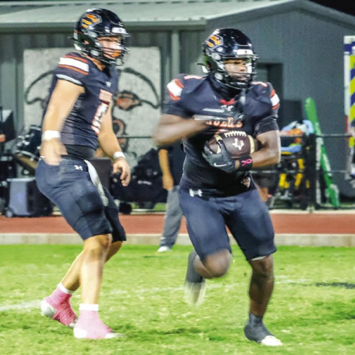 Schulenburg junior running back Jo’Juan Ford looks for a lane downfield two weeks ago against Thrall. The Shorthorns return home this Friday to host Lexington. Photo by Andy Behlen
