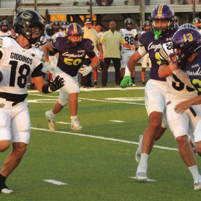 Giddings’ Colden Adams can’t find any running room as he is pursued by La Grange defensive players, left to right – Whitaker Samples, Luke Anderson, Chris Supak and Van Hill. Photo by Jeff Wick