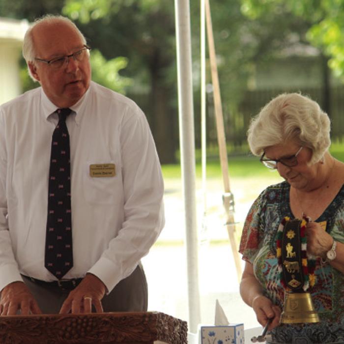 Dennis Zbranek reads the names of local veterans who had died since last Memorial Day, as Joan Miertschin strikes a bell after each name is read.