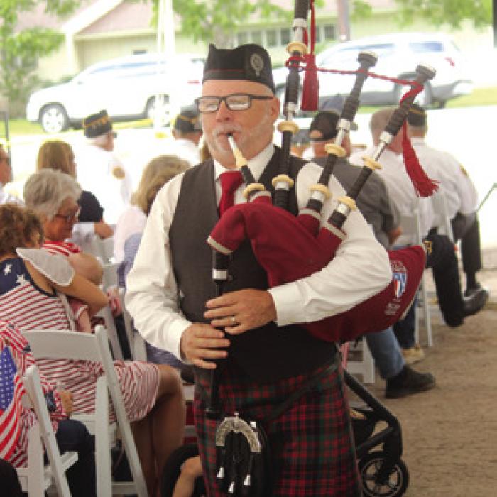 Richard Kean played a pair of bagpipe solos during Monday’s ceremony.