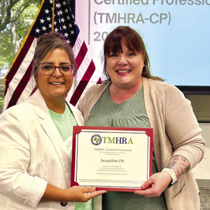 Jacqueline Ott (right), representing the City of Flatonia, earned certification through the Texas Municipal Human Resources Certification Program offered by the Texas Municipal Human Resources Association (TMHRA).
