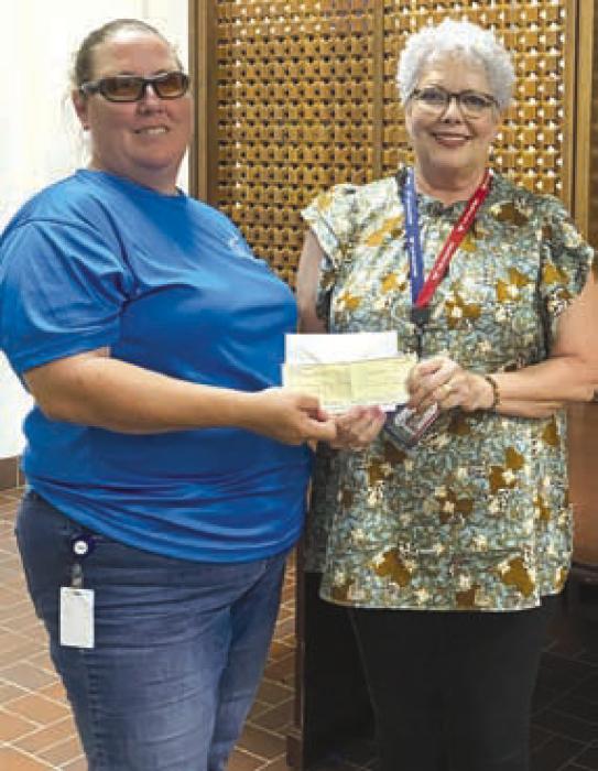 Donations from Bluebonnet Regents Council and Catholic Daughters Court #1962 are received by Janet Sheelar, Coordinator of Volunteer Services at the Giddings State School and provided by Sherry Hebert.