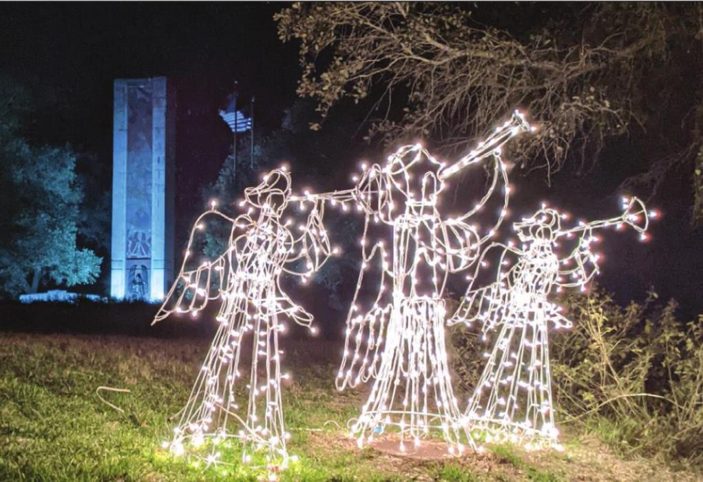 A trio of lighted angels with Monument Hill behind them at a previous year’s Trail of Lights at La Grange’s state historic site.