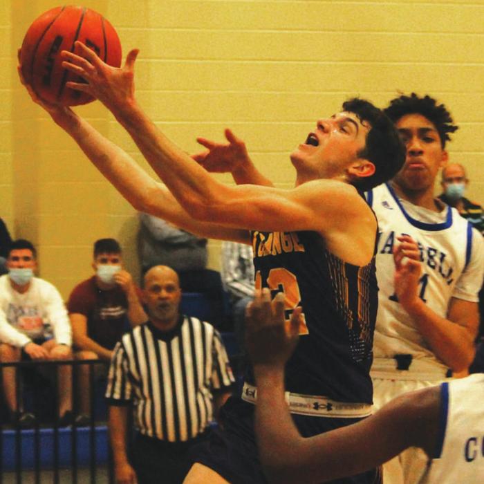 La Grange senior Caden Cooper drives to the basket in Tuesday’s 55-43 playoff victory over Jarrell in Rockdale. Photo by Jeff Wick