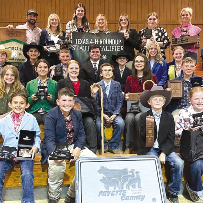Front from left: Emma Zweschper, Hudson Holub, Joesph Carrales, Abigale McBride; second row: Hayleigh Pizzitola, Adalyn Carrales, Kaisley Janecka, Tate Fritsch, Tatum Fritsch, Holden Holub; third row: Rilan Karisch, Dylan Zweschper, Abraham McBride, Logan Poncik, Crockett Guenther, Hailey Janish, Julia Melton; back row: Coach JoJo Carrales, Keeley Warnken, Madyson Holub, Haley Schramek, Kyrroll Prihoda, Rheagan Karisch and Coach Kaci.