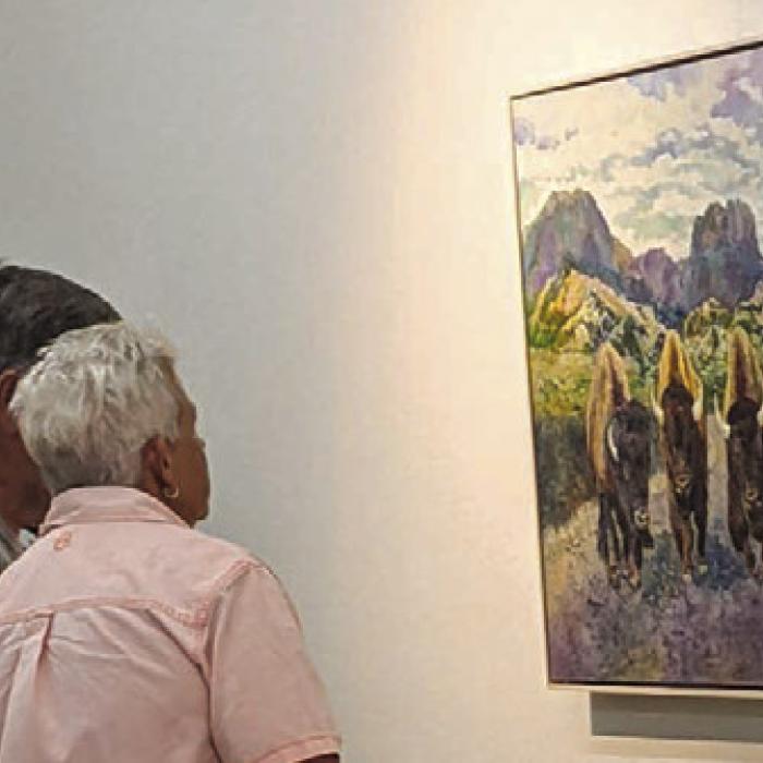 Onlookers enjoy “Bison Jam,” another piece skillfully painted by Hailey Herrera.