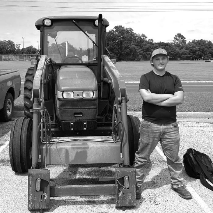 La Grange High School student Luke Chovanec kept alive the long standing LGISD tradition of drive-your-tractor-to-school day last week. Photo by Deacon Wick