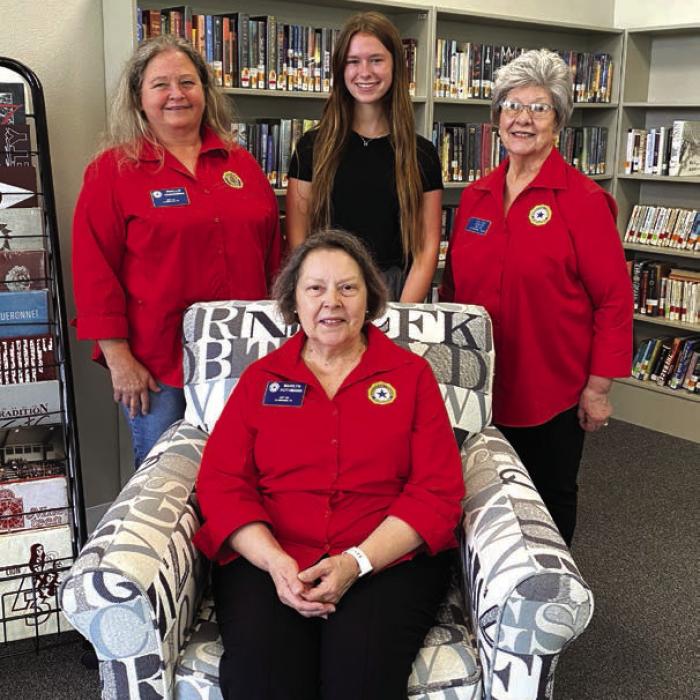 Girls State Coordinators Marilyn Kothmann sitting, left Phyllis Chavarria, and right, Stacy Ryza with Fayetteville High School Girls State selection Harper Mau, middle, standing.