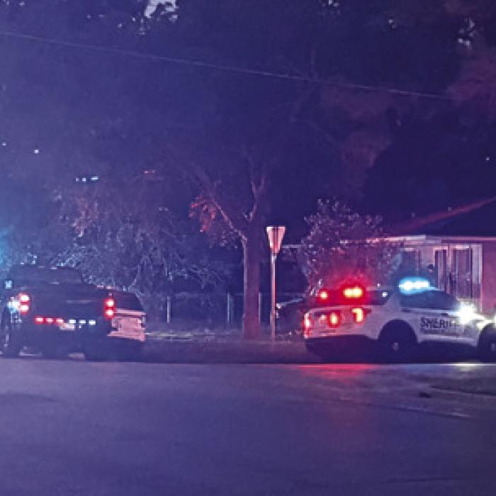 The scene of Wednesday night’s fatal shooting at the 400 block of Washington St. with multiple law enforcement and EMS personnel.