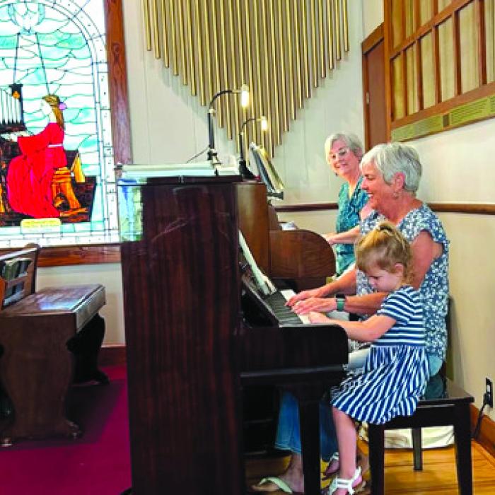 Betty Gail Guthmann, Sharon Fritsch and Sophia playing music st St. Paul Lutheran.