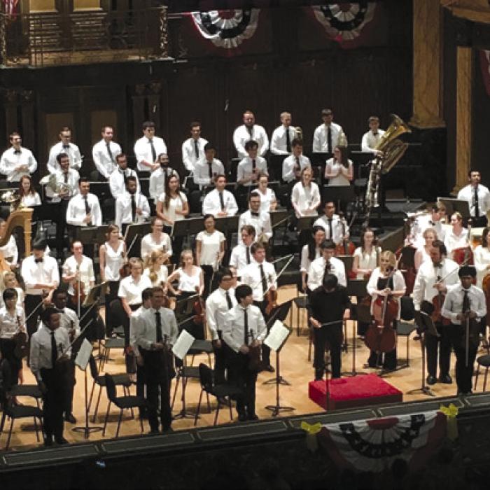 Round Top Music Festival Orchestra standing for applause after Patriotic Concert.