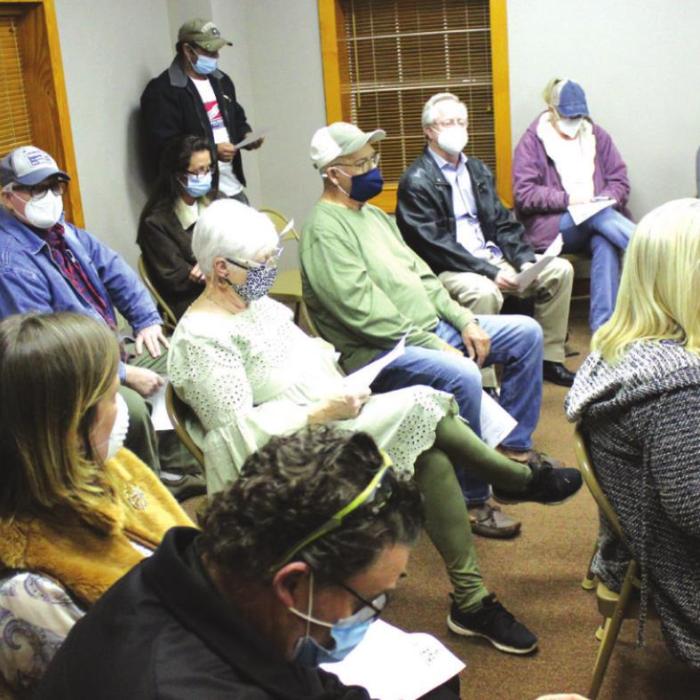 Shots of the crowd gathered, left, at Wednesday’s Fayetteville’s town council meeting, and right, the town council. Photos by Jeff Wick