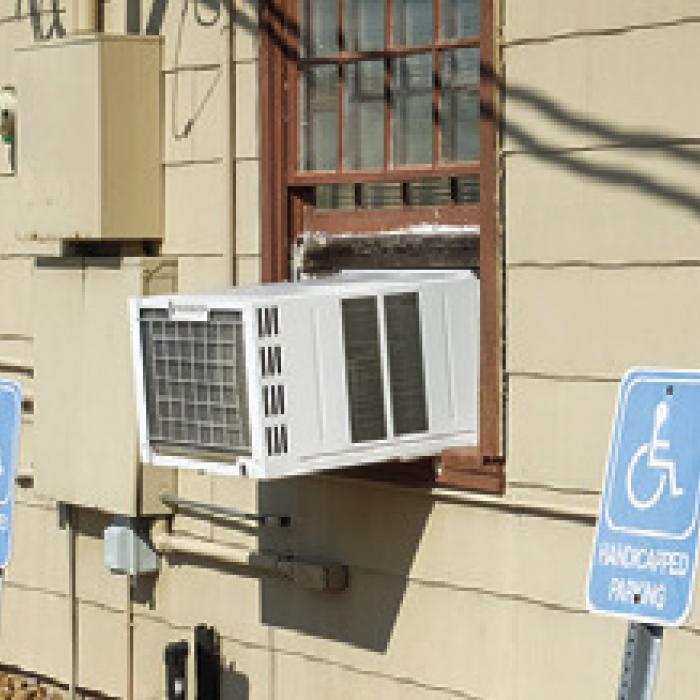 The La Grange VFW Hall relies on multiple window units for cooling and heat. Some of them look as though they’re about to fall out of the window.