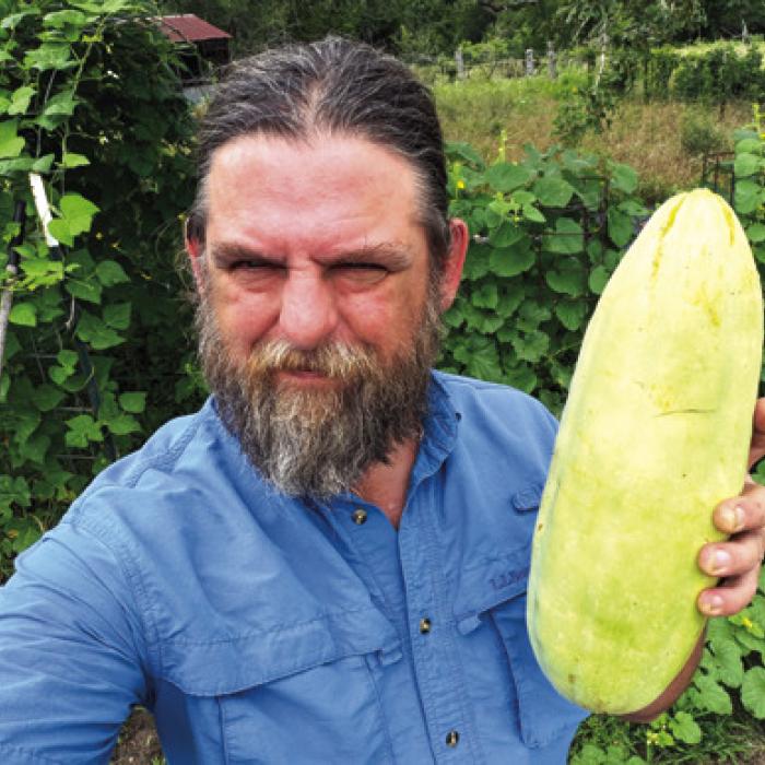 Andy Behlen with a whopper of an Xylangouro melon, which tastes a lot like cucumber.