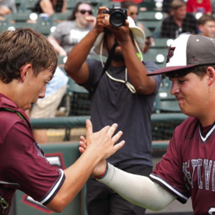 Catcher Dylan Henneke, left and back-up catcher Kellen Lopez celebrate after the final out of the title game. Photo by Scott Coleman