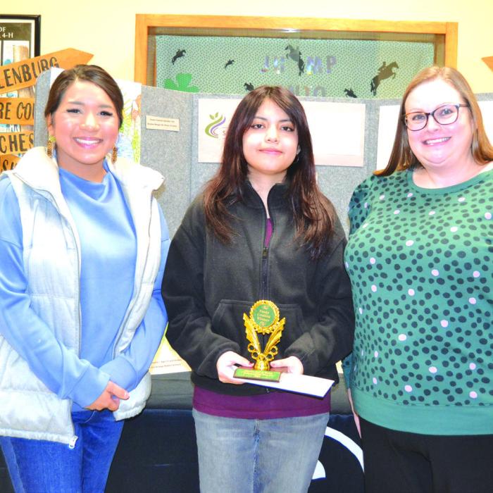 Essay Contest: (14-18 Division) - Ella Pineda (La Grange High School) not pictured, Nayeli Molina (La Grange High School); presenters: Amanda Castaneda and Jennifer Navarro of Flatonia National Bank.