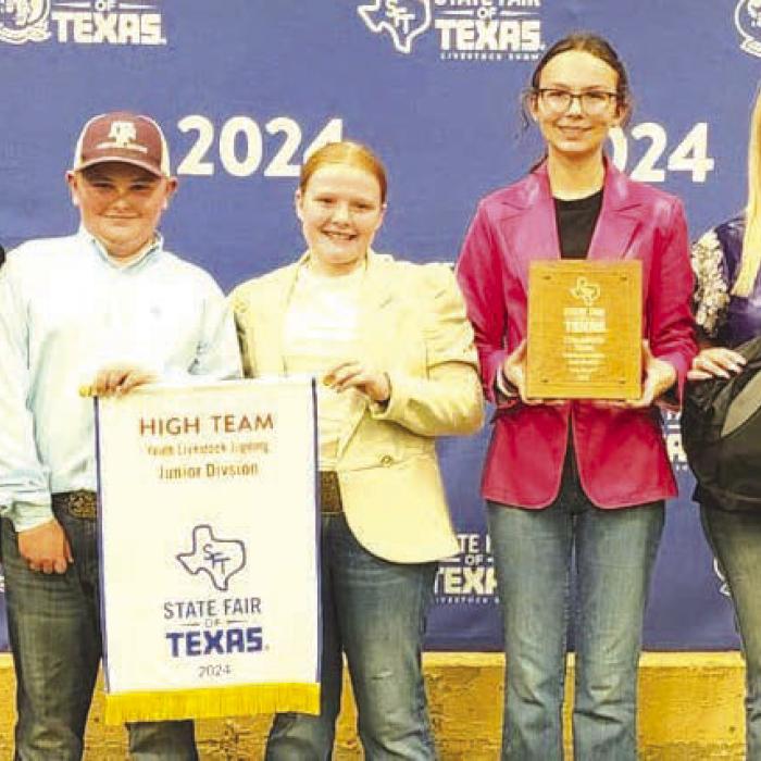 Champion Livestock Judging Team: Alexis Berckenhoff, Abraham McBride, Kaisley Janecka, Tatum Fritsch, and Coach Kaci Carrales.