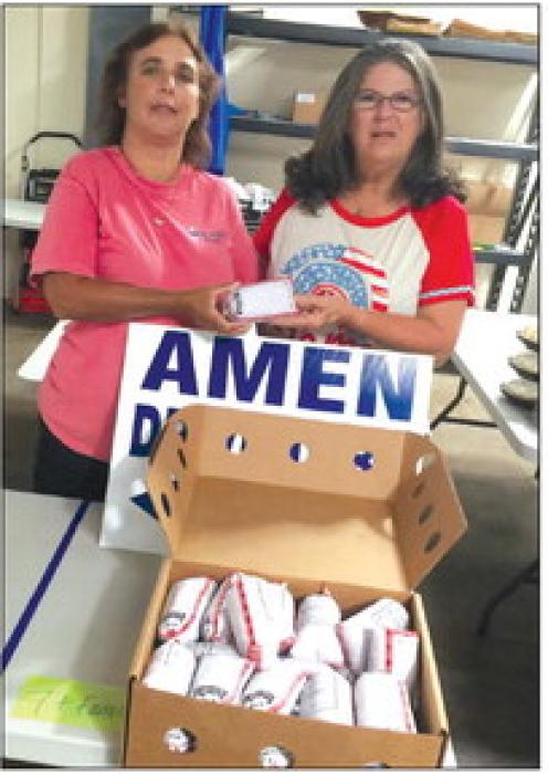 AMEN received donation from CattleWomen, pictured are left Cassie Girard, President, AMEN, and right, Robbie Cole, NVCW.
