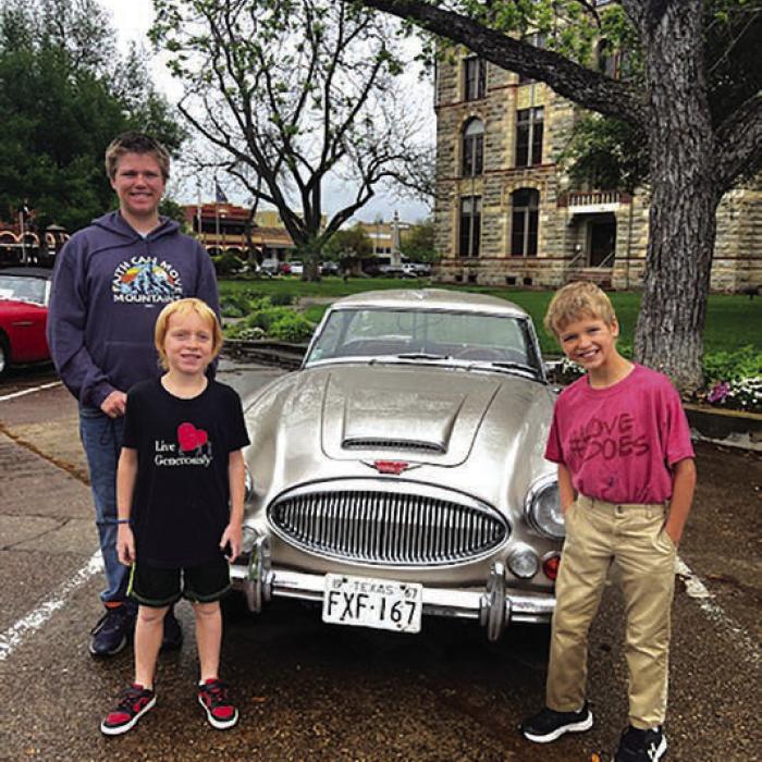 The rain didn’t stop Daniel, John and Caleb Lehmann from checking out the Austin Healey Car show in downtown La Grange on Saturday April 5. They met several Austin Healey owners and collectors of the club and one of them, Stephanie Colston from Sanger, Texas let Caleb and his brothers sit inside her fire-engine red Austin Healey. Photos courtesy of Erich Lehmann