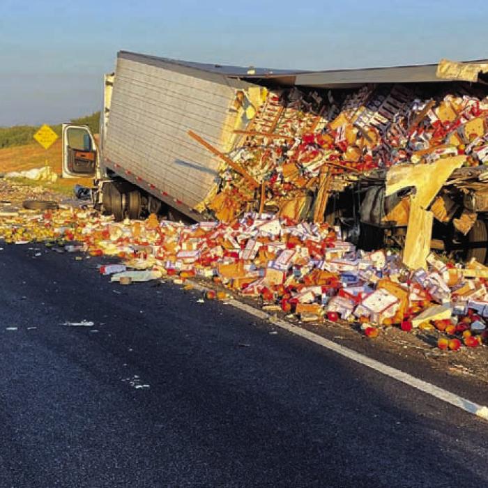 Mangos are strewn about on I-10 and one 18-wheeler struck another carrying the produce Friday. One person was ejected and killed because of the collision.