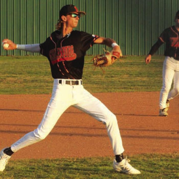 Schulenburg’s Connor Lichnovsky fields a grounder and throws to first in a district game earlier this season. Thursday, Lichnovksy shined on the mound for the Shorthorns, tossing a complete game two-hitter against Ganado. Photo by Jeff Wick