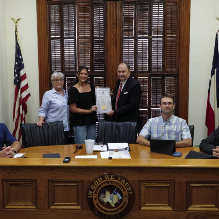 Fayette County Commissioners Court signed a proclamation last Thursday designating April as Fair Housing Month in Fayette County. On hand for the signing were representatives from the South Central Board of Realtors. Pictured are (from left) Pct. 4 Commissioner Drew Brossmann, Misty Blanchard of Centex Realty in La Grange, Hannah Mica of Legacy Land Associates in Flatonia, County Judge Dan Mueller, Pct. 2 Commissioner Clint Sternadel and Pct. 1 Commissioner Jason McBroom. Photo by Andy Behlen