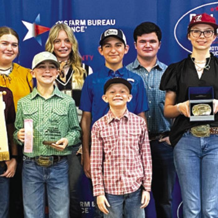 Pictured front from left: Emma Zweschper, Tate Fritsch, Crockett Guenther, Joe Carrales, Tatum Fritsch, Kaisley Janecka, and Coach Kaci Carrales; back row: Holden Holub, Rilan Karisch, Adalyn Carrales, Rheagan Karisch, Hailey Janish, Dylan Zweschper, Logan Poncik, and Hunter Gabler.