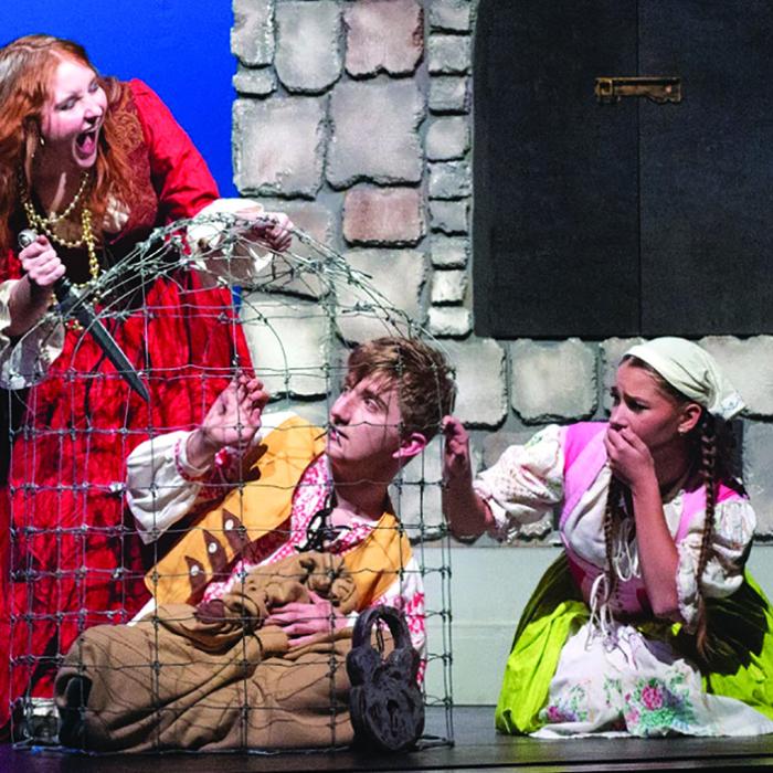 Molly Hudson, as the Witch, terrorizes Jackson Elliott (Hansel) and Brinley Freedman Gretel). Photo by Emma Anderson LHS yearbook staff