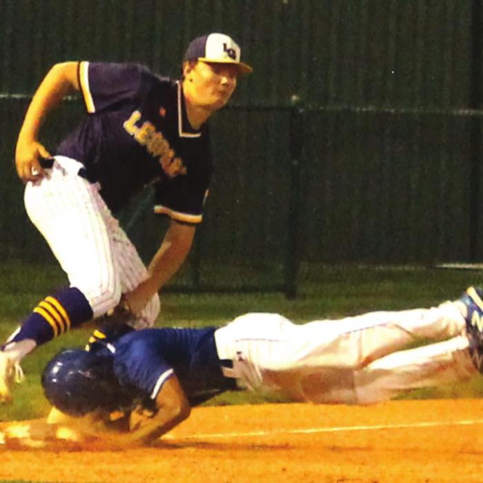 La Grange’s third baseman Trenton Barnes makes a tag Tuesday to get this Manor New Tech player out as he tried to stretch a double into a triple . Photo by Jeff Wick