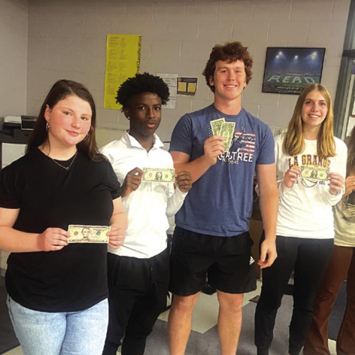 The La Grange LEO Club would like to thank Mr. Thomas Petras, left, Senior Vice President with Prosperity Bank for sponsoring their March LEO Club meetings. Mr. Petras spoke to the students about job opportunities within the banking industry, interview skills, loan and investment options, and conducted a fun game with cash rewards.