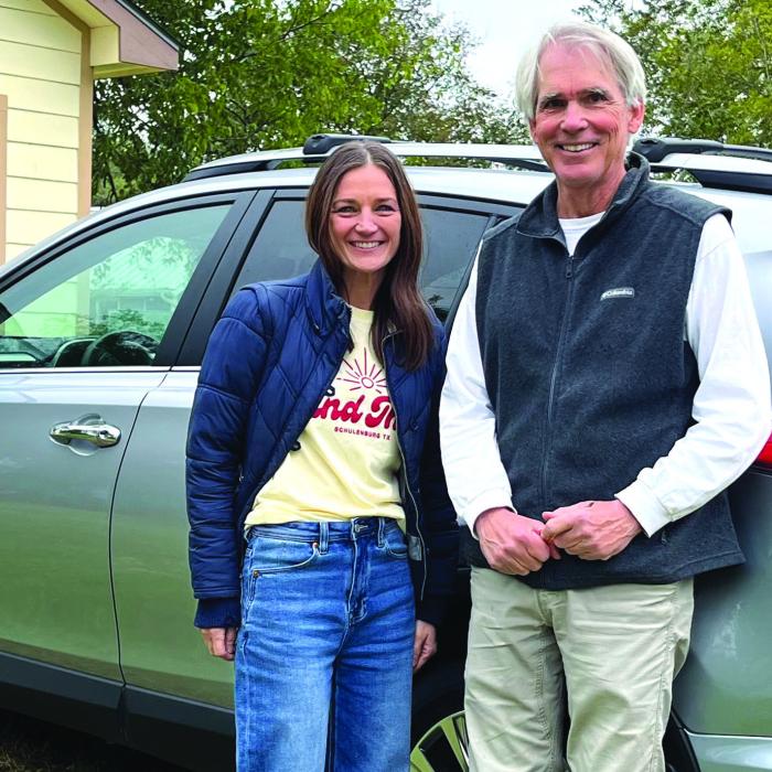 Erin Wotipka (Left) and Bill Bishop (Right) with the car Bishop donated to the group “And Then a New Day.”