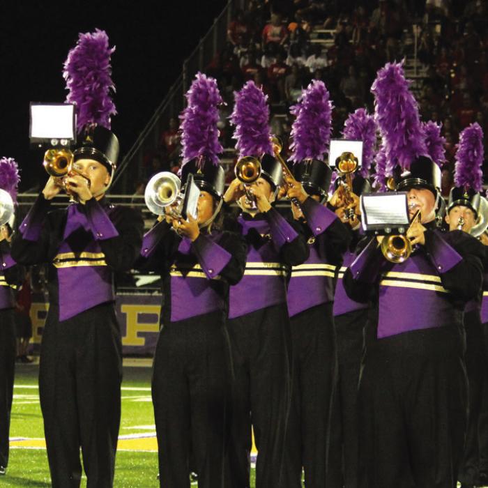 Clockwise from top, left: The La Grange flag corps, the cheerleaders leading out the football team before the game, the drill team, a battle in the trenches, Bravion Rogers punting, and the mighty Leopard band. Photos by Jeff Wick