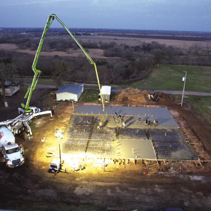 Workers with Supak’s Inc. poured a concrete slab for the new German-Czech Mart at the Fayette County Fairgrounds, working all day and late into the night on Thursday, Feb. 13.