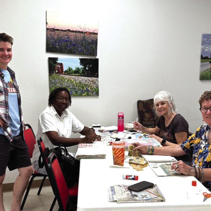 Jaime Janda on the left is consulting with a few of our creative ladies in her Artful Friday class. Working on their art journals are Deborah Jones, Kim Penland, and Berni Gillings. Each of their individual creations are works of art.