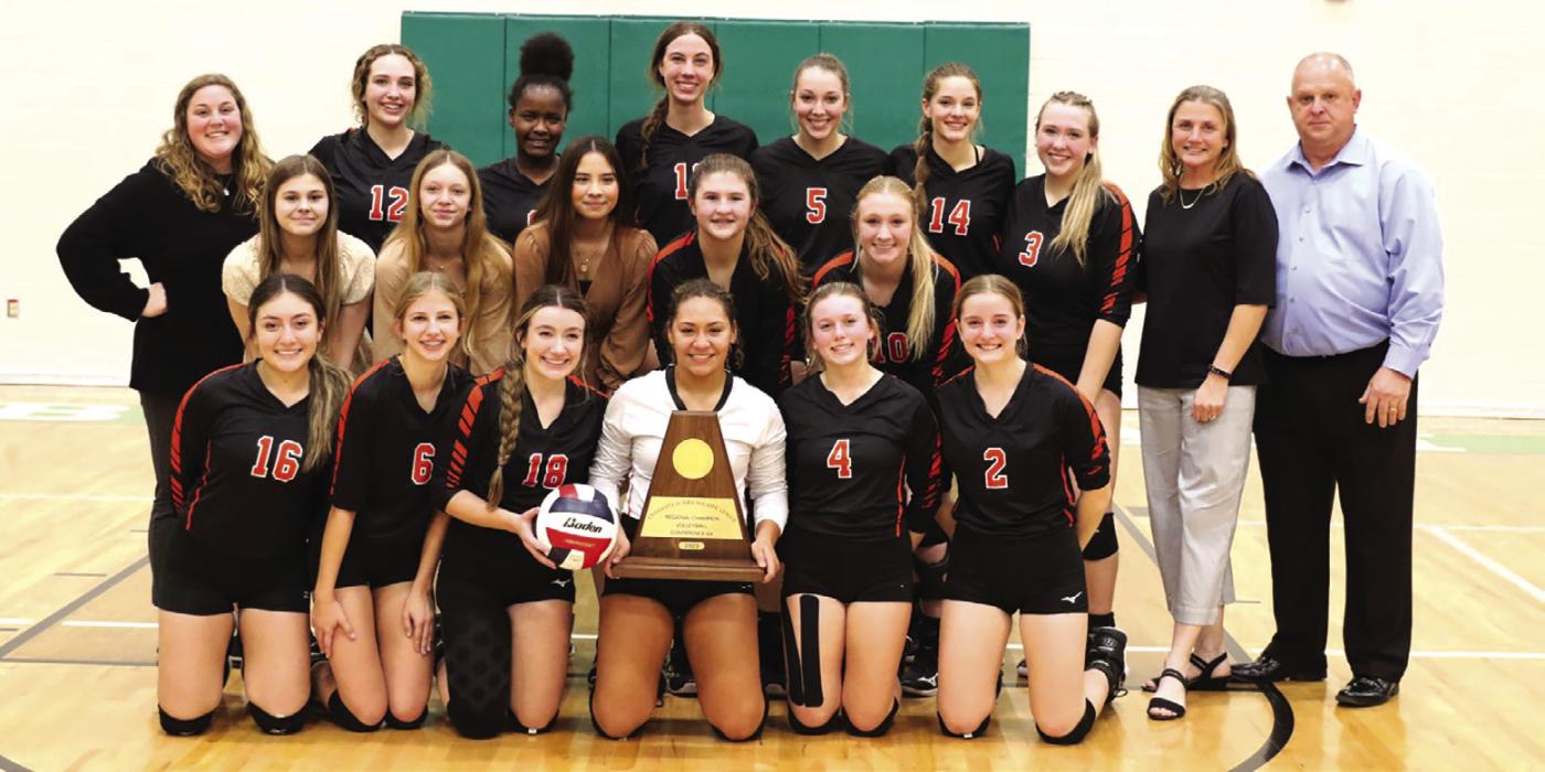 The members of the Schulenburg volleyball team hold their regional title trophy Saturday after beating Johnson City. Photo by Audrey Kristynik