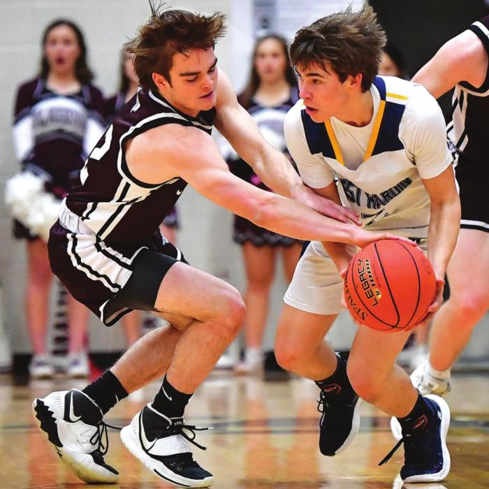 Justin Marler works for the steal for the Flatonia Bulldogs Thursday night in the Area playoff game against West Hardin. The Bulldogs earn the title with a 90-46 win. Photo by Stephanie Steinhauser