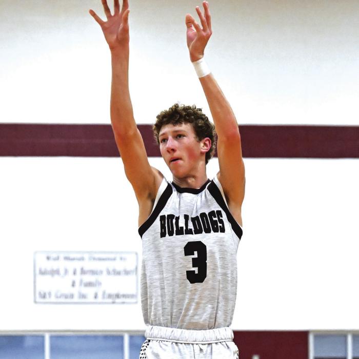 Camden Bosl puts up a three point shot for Flatonia in Tuesday night’s win over Iola to improve to 13-0. Photo by Stephanie Steinhauser