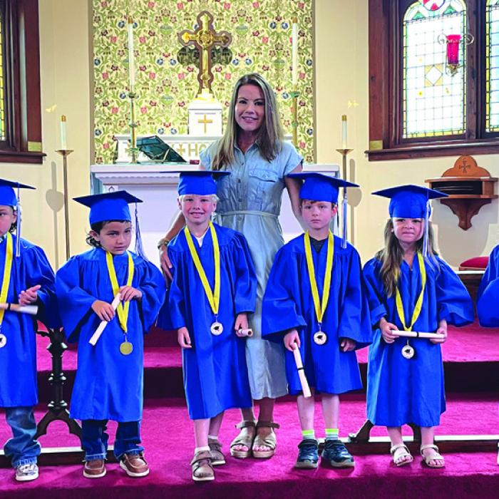 St. James Episcopal Preschool in La Grange held their Pre-Kindergarten Graduation and moving up ceremony last week. Eight students donned caps, gowns, and tassels to signify their readiness to enter Kindergarten. Also shown here is their teacher Ashley Abbey. Twenty-three more students celebrated “moving up” in preschool, with most of them returning to St. James in the fall. For more information on St. James Preschool, including enrollment information, email laurie@stjameslagrange.org.