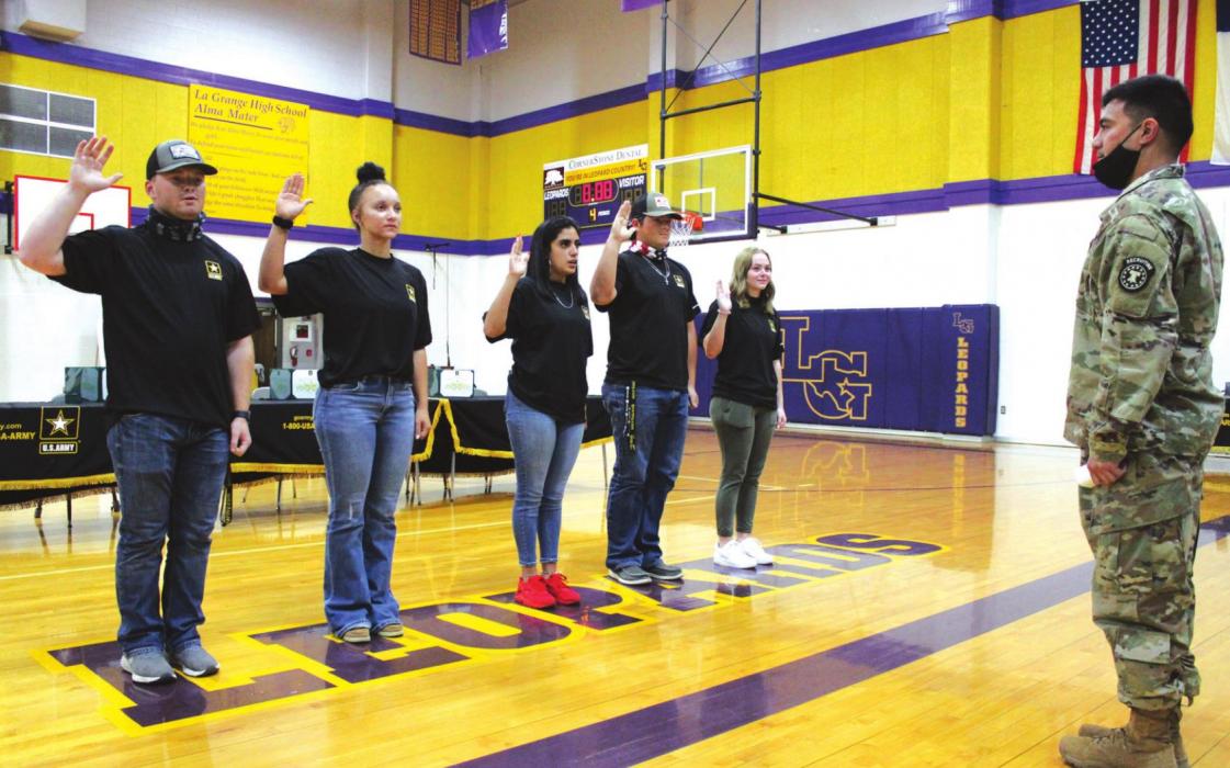Left to right, La Grange high school seniors Caleb Burton, Kailee Jones, Courtney Pacheco, Kaleb Pyle and Abigail Sparks take their Oath of Enlistment in the US Army Wednesday. Photos by Jeff Wick