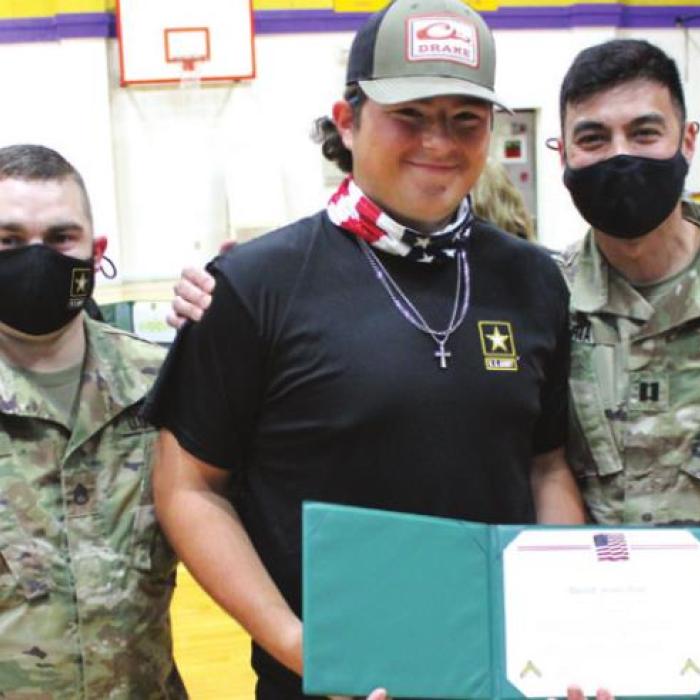 Left: Kaleb Pyle was surprised with a special promotion to Private First Class Wednesday because of advance work he did.