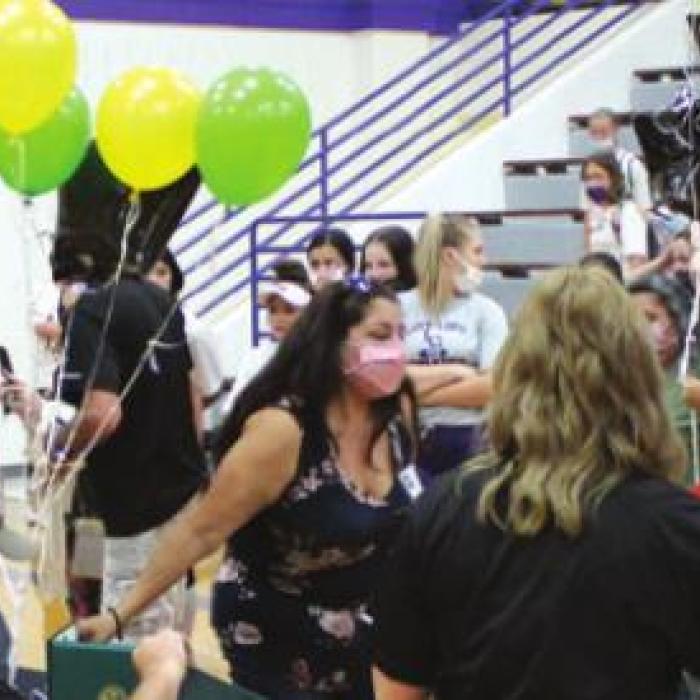 Below: Lots of balloons and hugs Wednesday. This was the first official Army signing day held at LHS, but organizers hope to make it an annual event.