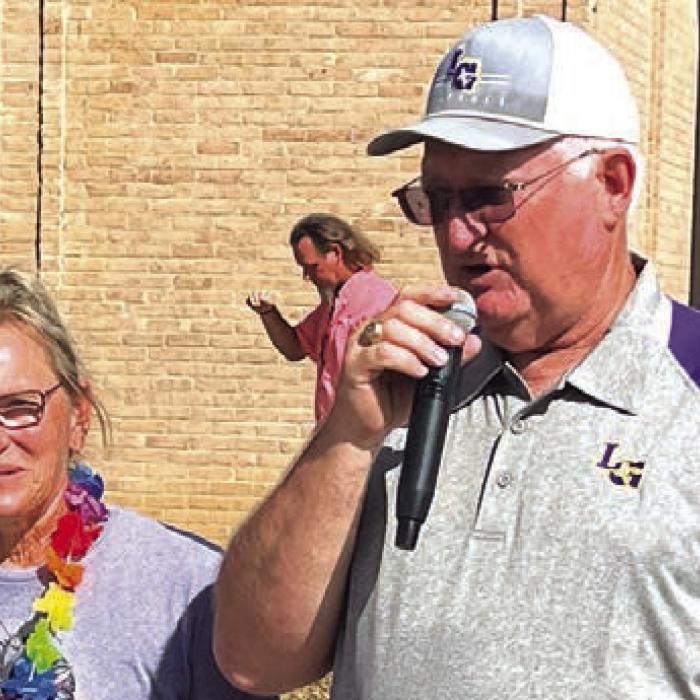 Fayetteville’s Terri McPherson, left, was introduced to the crowd downtown prior to the parade as this year’s Fair Volunteer of the Year by Lee Fritsch, right. McPherson is the longtime owner of Orsak’s Cafe in Fayetteville, but also has a long history of volunteering with the fair, particularly in the ticket booth.