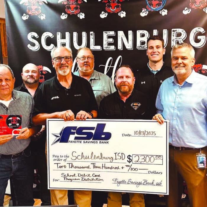 On hand as Fayette Savings Bank presented a check to Schulenburg ISD through its School Spirit Debit Card Program were (from left): Brad Tumis, Rodney Kalich – FSB, Jarrod Schramek – SISD board; Mike Olle, FSB; Michael Zweschper, Michael Demel, Hale Hentges, Supt. Lee Hafley, Troy Brenek – SISD board.